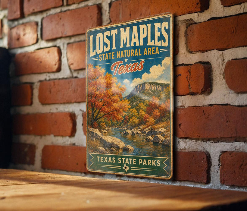 A vintage-style sign for Lost Maple State Natural Area in Texas, featuring a scenic landscape with a river and autumn foliage.