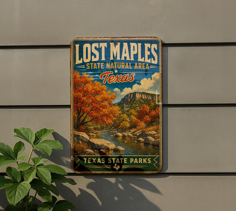 A vintage-style sign for Lost Maple State Park in Texas, featuring a scenic landscape with autumn trees and a river.