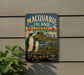 A vintage metal sign advertising Macquarie Island, Australia, featuring a scenic illustration of penguins and a seal in a natural landscape.