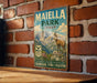A vintage metal sign for Maiella Park, Italy, featuring an illustration of a mountain landscape with a goat.