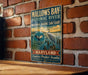 A vintage metal sign for the Mallow's Bay-Potomac River National Marine Sanctuary in Maryland, featuring an illustration of a bird and a body of water.