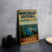 A vintage-style metal sign for the Manicouagan-Uapishka Biosphere Reserve in Canada, featuring a moose and a scenic landscape.