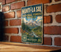 A vintage-style metal sign for the Manti-La Sal National Forest in Utah, featuring a scenic mountain landscape with pine trees and a river.