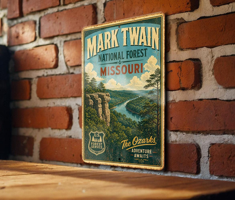 A vintage-style metal sign for the National Forest in Missouri, featuring a scenic illustration of a forest landscape with a river and mountains.