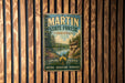 A vintage-style metal sign for Martin State Forest in Indiana, featuring a scenic landscape with a lake and forest.