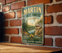 A vintage-style metal sign for Martin State Forest in Indiana, featuring a scenic landscape with a lake and mountains.