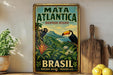 A vintage-style poster advertising the Mata Atlantica Biosphere Reserve in Brazil, featuring a toucan and lush tropical foliage.