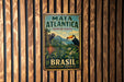 A vintage metal sign for the Mata Atlantica Biosphere Reserve in Brazil, featuring a toucan and lush tropical foliage.