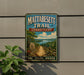 A vintage trail sign for the Mattabesett Trail in Connecticut, featuring a scenic landscape with a path, trees, and a lake.