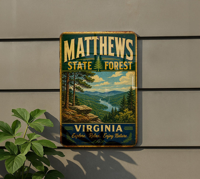 A vintage metal sign for Matthews State Forest in Virginia, featuring a scenic landscape with pine trees and a river.
