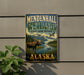 A vintage-style metal sign for Mendenhall Wetlands, Alaska, featuring a moose and other wildlife in a scenic landscape.