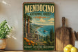 A vintage-style sign for Mendocino National Forest, California, featuring a scenic landscape with pine trees, mountains, and a body of water.