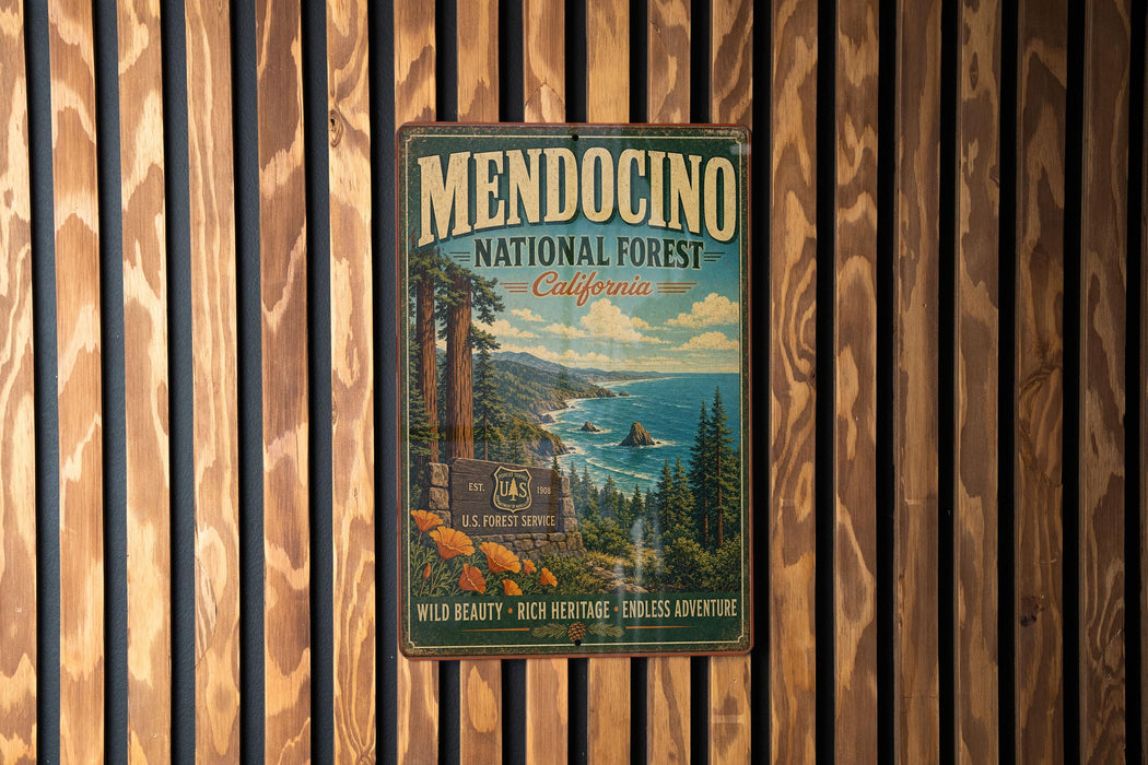 A vintage metal sign for Mendocino National Forest in California, featuring a scenic landscape with a forest, mountains, and a body of water.