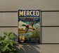 A vintage-style metal sign for the Merced National Wildlife Refuge in California, featuring a duck in flight and a serene landscape.