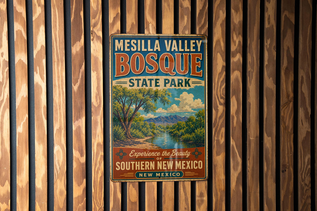 A vintage-style metal sign for Mesilla Valley Bosque State Park, featuring a scenic landscape with a river and mountains.