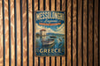 A vintage metal sign for Messolonghi Lagons, a natural beauty and rich heritage destination in Greece, is displayed on a wooden wall.