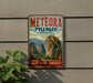 A vintage-style metal sign for Meteora, Pyli Park, Greece, featuring a scenic mountain landscape with a castle-like structure on top.