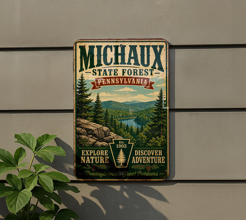 A vintage-style metal sign for the Michaux State Forest in Pennsylvania, featuring a scenic landscape with pine trees, mountains, and a river.