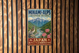 a vintage-style metal sign with a mountain landscape and a bird, mounted on a wooden wall.