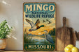 A vintage-style metal sign for the Mingso National Wildlife Refuge in Missouri, featuring illustrations of ducks and other wildlife.