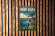 A vintage-style metal sign for Minneconka State Park Preserve, featuring a scenic landscape with a lake, cliffs, and pine trees.