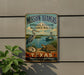 A vintage-style sign for the Mission-Aransas National Estuarine Research Reserve in Texas, featuring a heron, a turtle, and a boat on a body of water.