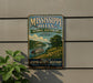 A vintage-style sign for the Mississippi Hills National Heritage Area, featuring a river scene with a steamboat and a lush green landscape.