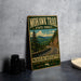A vintage-style metal sign for the Mohawk Trail in the state forest of Massachusetts, featuring a scenic mountain landscape with a winding road.