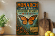 A vintage-style sign advertising the Monarch Butterfly Biosphere Reserve in Mexico, featuring a large orange and black butterfly and surrounded by flowers and greenery.