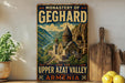 A vintage-style metal sign with the text "MONASTERY OF GEGHARD AND THE UPPER AZAT VALLEY ARMENIA" and an illustration of a mountainous landscape with a church or cathedral.