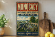 a vintage-style metal sign with a painting of a cannon and a bridge, placed on a wooden surface next to a wooden cutting board and some lemons.