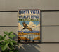 A vintage-style metal sign for the Monte Vista National Wildlife Refuge in Colorado, featuring a large bird in flight and a scenic landscape.