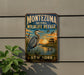 A vintage-style metal sign for the Montezuma National Wildlife Refuge in New York, featuring a large blue heron and ducks in a serene landscape.