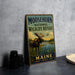 A vintage metal sign for the Moosehorn National Wildlife Refuge in Maine, featuring an illustration of a moose in a natural setting.