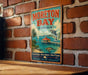 A vintage travel poster for Moreton Bay, Australia, featuring a beach scene with a dolphin, palm trees, and a wooden pier.