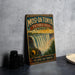 A vintage travel poster advertising Mosi-Oa-Tunya Victoria Falls, Africa, featuring a waterfall and lush greenery.