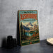 A vintage metal sign for Mount Assiniboine Provincial Park in British Columbia, Canada, featuring a scenic mountain landscape.
