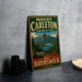 A vintage-style sign for Mount Carleton Provincial Park in New Brunswick, Canada, featuring a mountain landscape and a river.