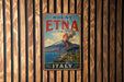 A vintage metal sign with the text "Mount Etna Italy" and an illustration of a volcano with a town in the background.