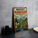 A vintage-style sign for Mount Hakusan, a biosphere reserve in Japan, featuring a mountain landscape with flowers and a stream.