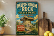 A vintage-style sign for Mushroom Rock State Park in Kansas, featuring a large mushroom formation and text promoting the park's natural wonders.