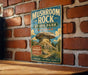 A vintage metal sign for Mushroom Rock State Park in Kansas, featuring an illustration of a mushroom formation and text promoting the park's natural beauty and outdoor activities.