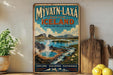 a vintage travel poster advertising the region of Iceland, with a scenic landscape of mountains, water, and steam.