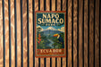 A vintage-style metal sign for Napo Sumaco Park in Ecuador, featuring a tropical landscape with a toucan and a mountain in the background.