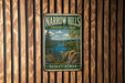 A vintage metal sign for Narrow Hills Provincial Park in Saskatchewan, featuring a scenic landscape with a lake and mountains.