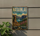 A vintage-style sign for "NATAINLAII TERRITORIAL PARK" is displayed on a wall, featuring a scenic mountain landscape with a waterfall.