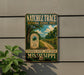 A vintage trail sign for the Natchez Trace National Scenic Trail, featuring a scenic landscape with a dirt path and trees.