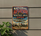 a vintage metal sign with the text "National Aviation Heritage Area Ohio" and an illustration of a biplane.