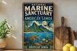 A vintage-style sign for the National Marine Sanctuary of American Samoa, featuring a tropical island landscape with a turtle, fish, and palm trees.