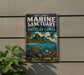 A vintage-style metal sign for the National Marine Sanctuary of American Samoa, featuring a tropical island landscape with a turtle, fish, and palm trees.